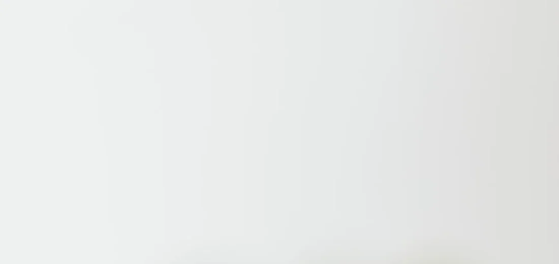 Plain white background with subtle vertical lines; no plant material visible